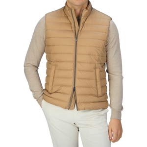 A man in a Herno Sand Beige Nylon Goose Down Quilted Gilet.
