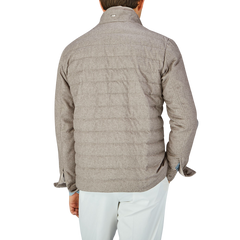 The back view of a man wearing a Herno Taupe Beige Silk Cashmere Water-Repellent Jacket.