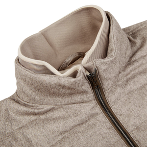 A close up of a Herno Taupe Beige Silk Cashmere Water-Repellent Jacket with a zipper.