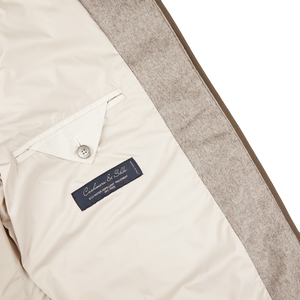 A Herno Taupe Beige Silk Cashmere Water-Repellent Jacket with a slim fit, featuring a label on the back.