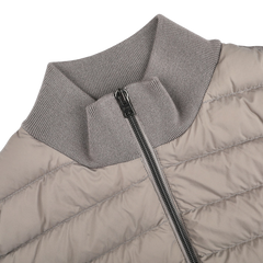 Close-up of the Herno Taupe Beige Wool Silk Nylon Padded Jacket with a quilted pattern, ribbed collar, and sleek black zipper.