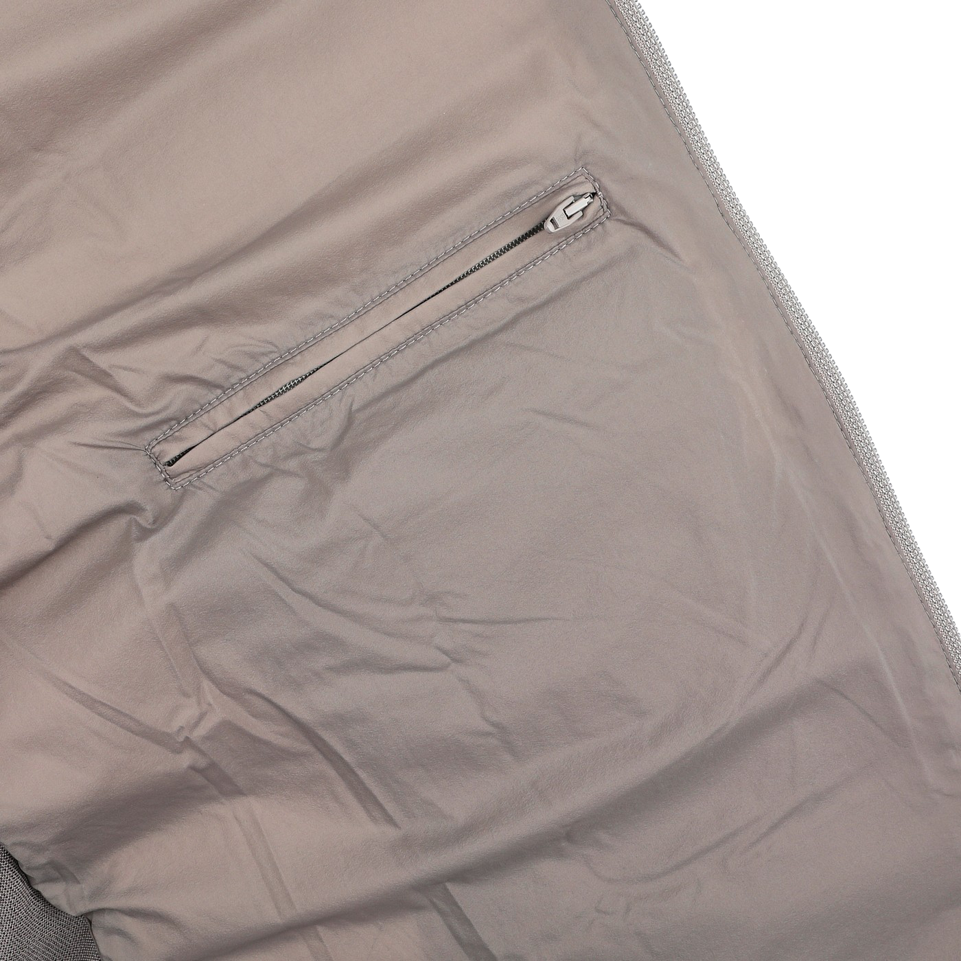 Close-up of a Herno Taupe Beige Wool Silk Nylon Padded Jacket fabric featuring a horizontal zipper pocket.