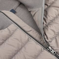 Close-up of a partially unzipped Herno Taupe Beige Wool Silk Nylon Padded Jacket, highlighting the zipper and inner lining.