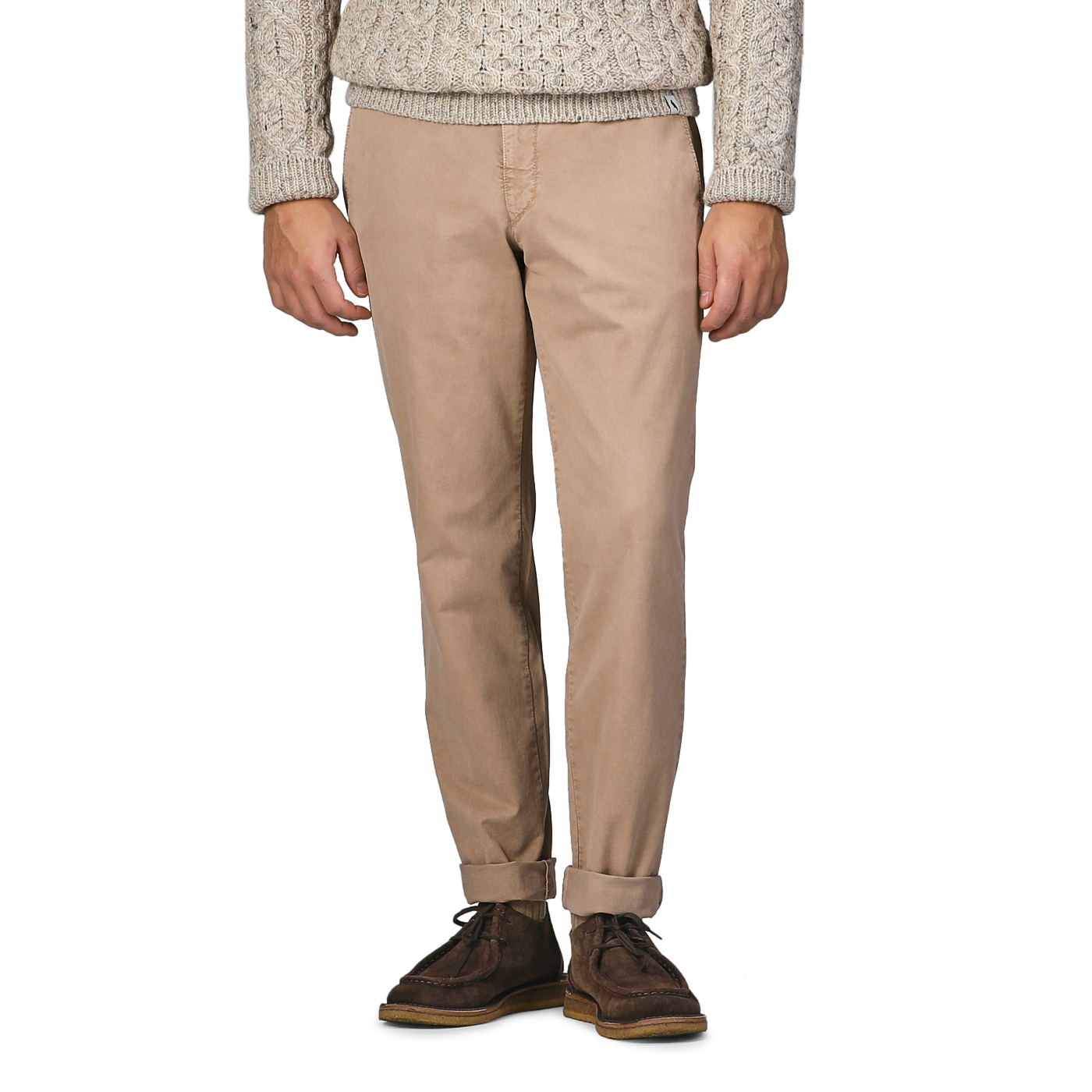 A person wearing a beige cable-knit sweater, Beige Washed Cotton Gabardine Slim Chinos by Hiltl, and dark brown shoes stands against a plain background.