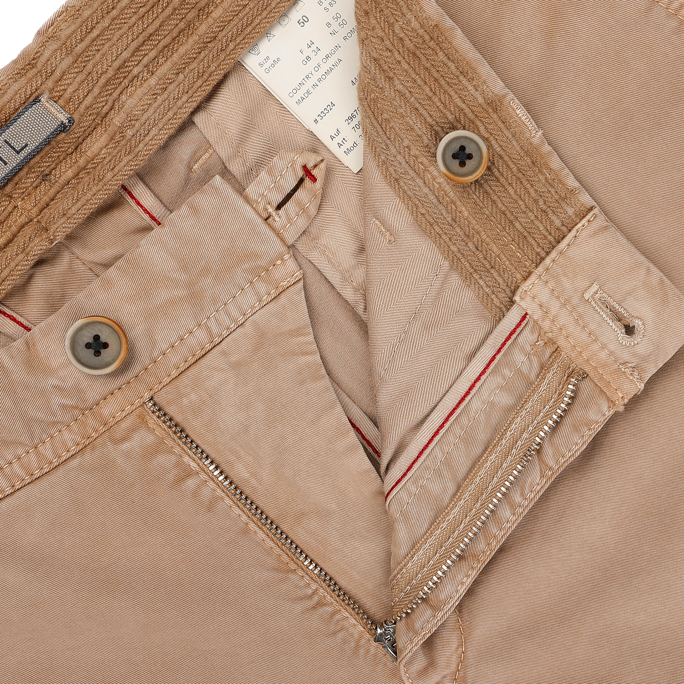 Close-up of Hiltl's Beige Washed Cotton Gabardine Slim Chinos, highlighting the zipper, buttons, and interior labels, crafted from premium materials.