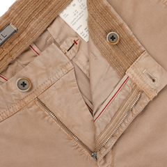 Close-up of Hiltl's Beige Washed Cotton Gabardine Slim Chinos, highlighting the zipper, buttons, and interior labels, crafted from premium materials.