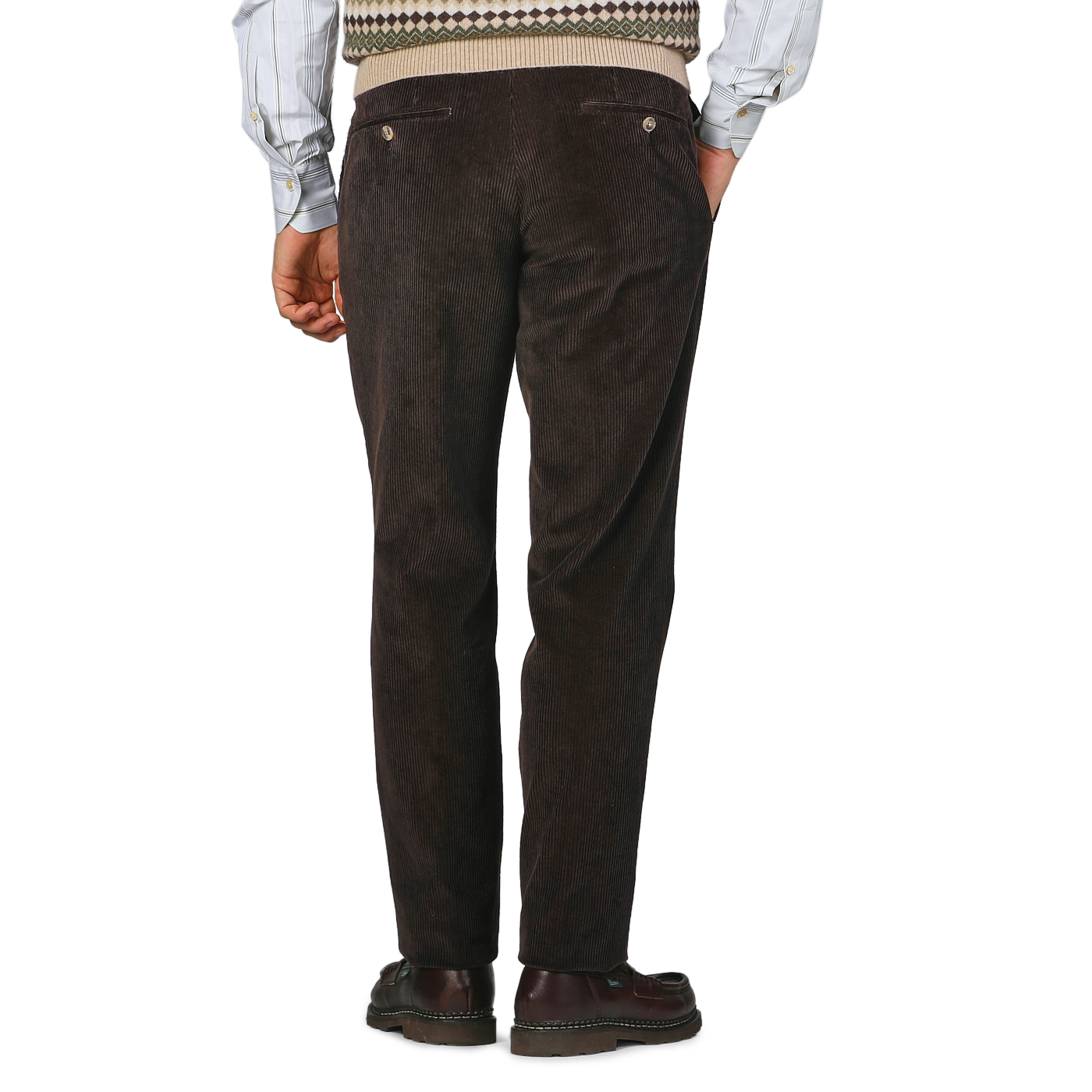 A person wearing Hiltl Brown Cotton Corduroy Regular Fit Chinos, a patterned sweater, and brown shoes is standing with their back facing the camera.