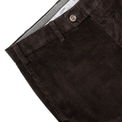 Close-up of Hiltl's Brown Cotton Corduroy Regular Fit Chinos, showcasing a single button and a pointed waistband.