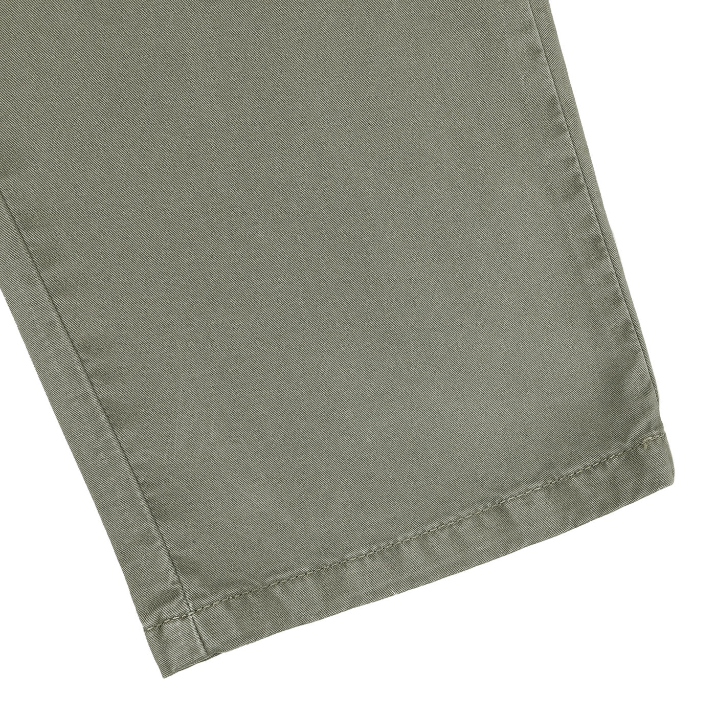 Close-up of a leg from the Green Washed Cotton Gabardine Slim Chinos by Hiltl, showcasing visible stitching near the hem.