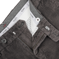 Close-up of a pair of Hiltl's Grey Cotton Corduroy Regular Fit Chinos with the front zipper partially open, showcasing the waistband with labels and patterned lining.