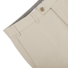 A close-up of the Khaki Cotton Stretch Regular Fit Chinos by Hiltl reveals pure cotton twill fabric, featuring a buttoned waistband and belt loops, along with a subtly checked inner lining.