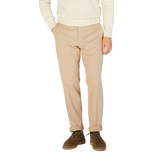 A man wearing Hiltl Light Beige Cotton Stretch Regular Fit Chinos.