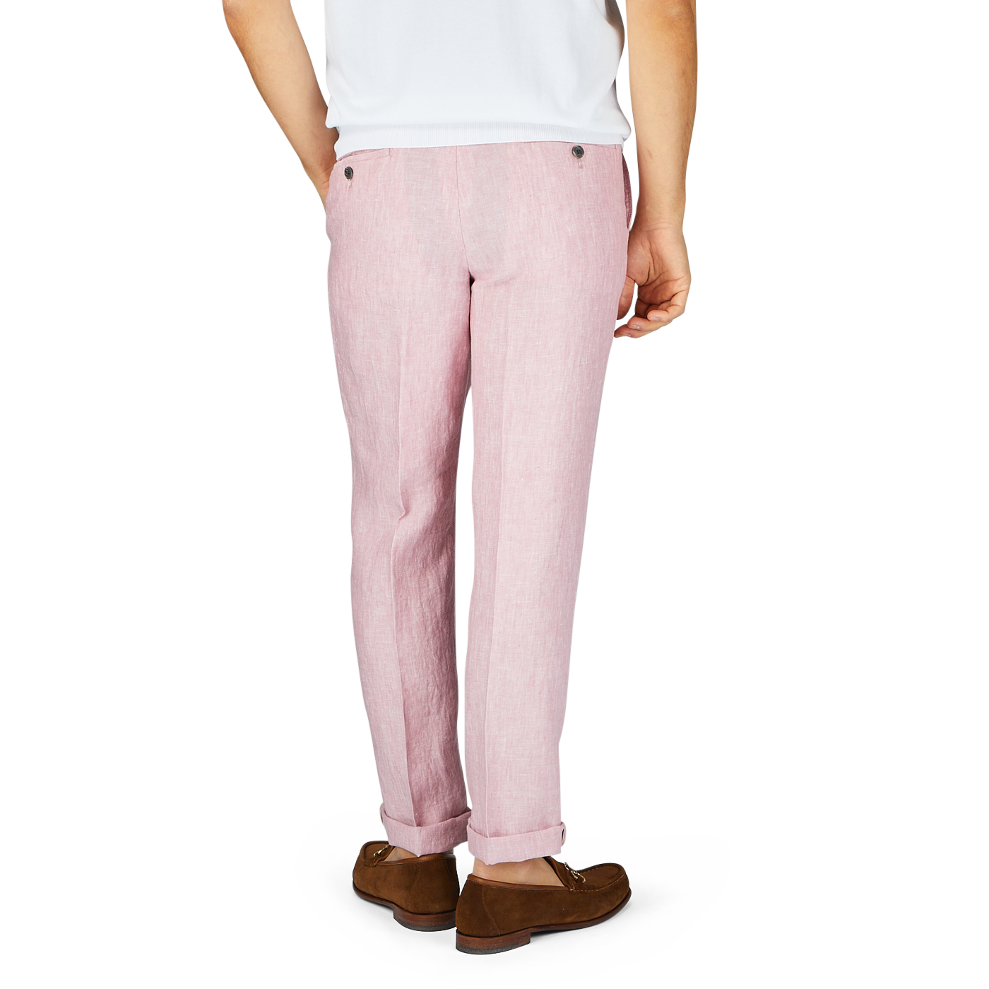 A person wearing Hiltl light pink washed linen regular fit chinos and brown loafers stands against a plain background, showing only from the waist down.
