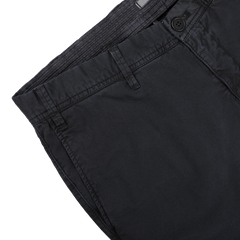 Close-up of Hiltl's Navy Washed Cotton Gabardine Slim Chinos, designed with a button and belt loops, displayed flat on a white surface.