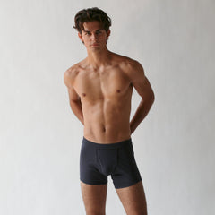 A person standing against a plain background, wearing Wil Organic Pima Cotton Trunks from The White Briefs.