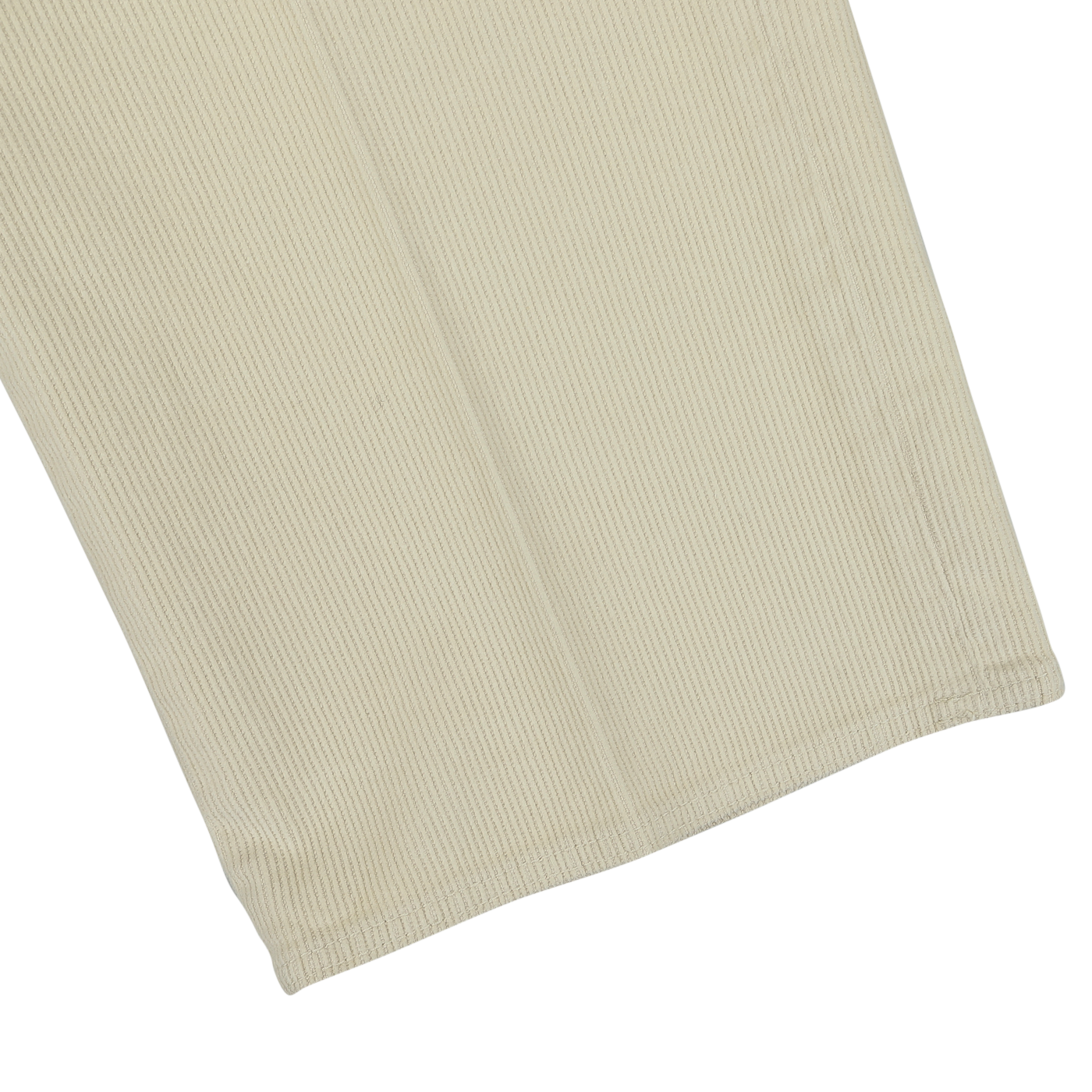 Close-up of the bottom hem of a pair of Incotex Beige Cotton Corduroy High Comfort Chinos on a neutral background.