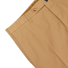 Close-up of the waistband of a pair of Incotex Beige Cotton Stretch Regular Chinos in khaki, featuring a tan button and belt loops.