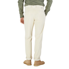 The back view of a man wearing Incotex Cream Beige Cotton Corduroy Slacks Chinos.