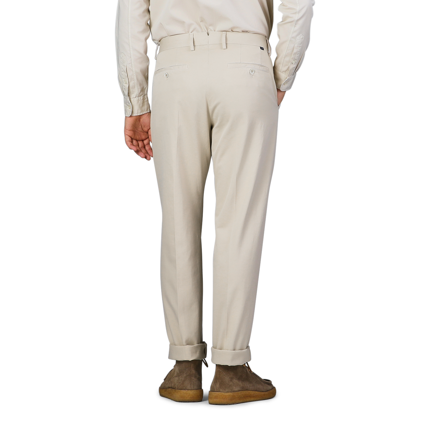 An individual wearing Incotex's Cream Beige Cotton Stretch Model 8 Chinos paired with brown shoes, seen from behind.