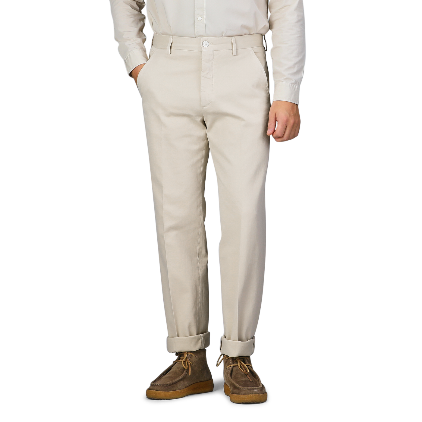 A person wearing Cream Beige Cotton Stretch Model 8 Chinos by Incotex, paired with a white shirt and brown shoes, stands with hands in pockets.