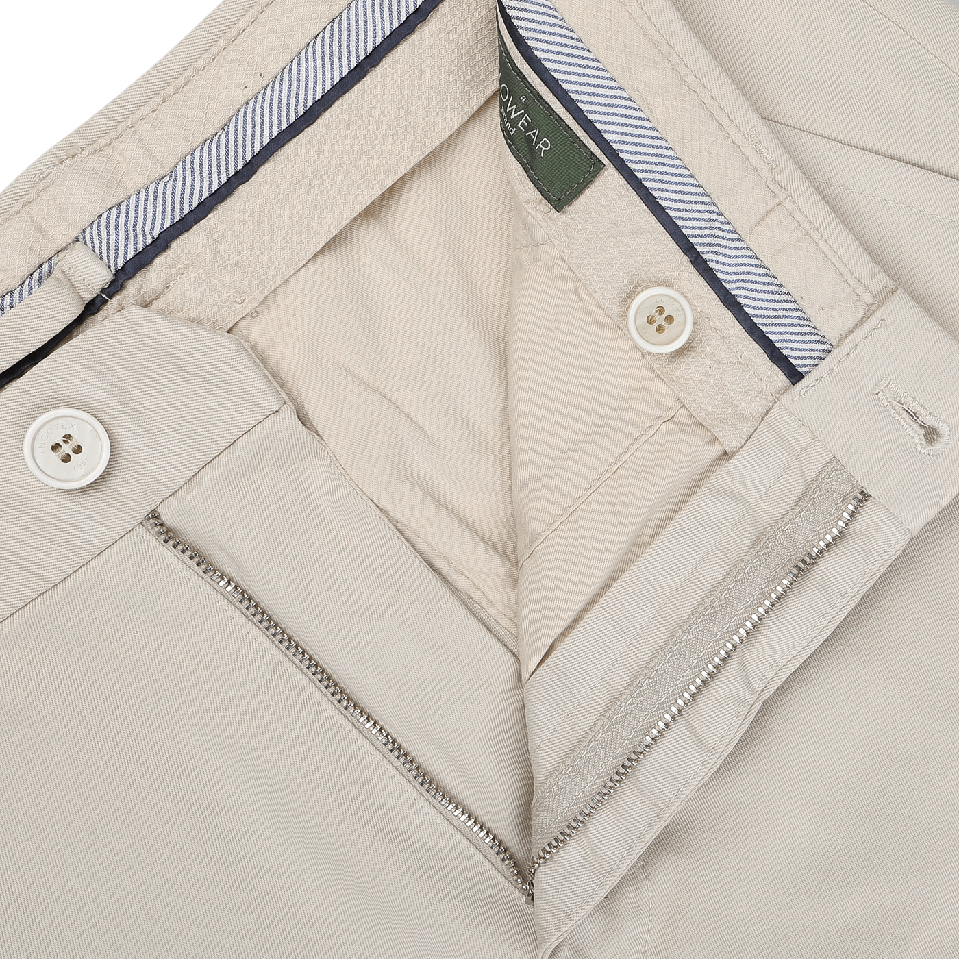 The Cream Beige Cotton Stretch Model 8 Chinos by Incotex feature a striped waistband lining, white buttons, and a partially open zipper, crafted from cotton twill for ultimate comfort.