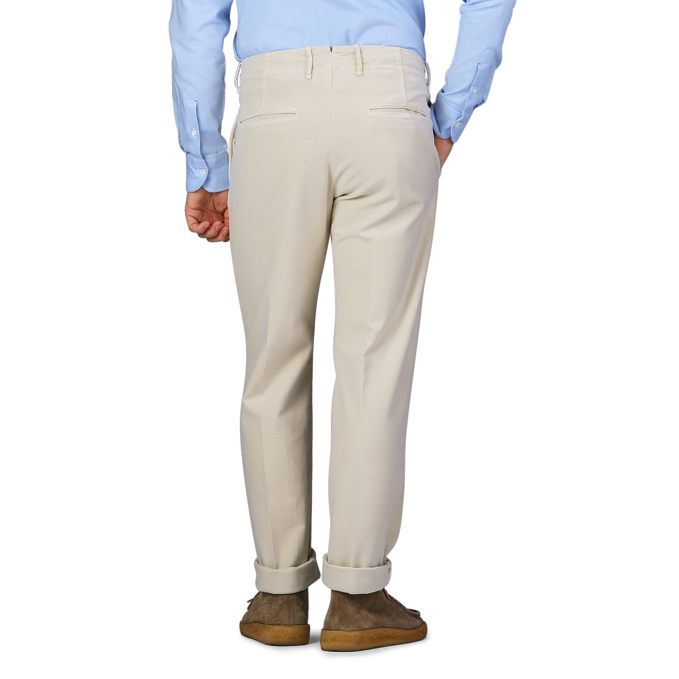 A person wearing Incotex Cream Beige Cotton Moleskin Slacks Chinos and a light blue shirt, viewed from the back.