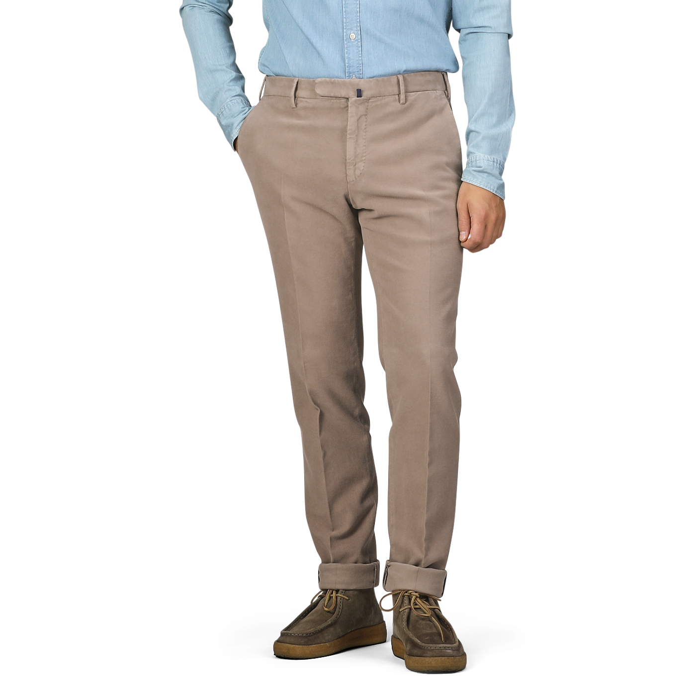 A person in a light blue shirt and Dark Beige Cotton Moleskin Model 30 Chinos by Incotex, hands in pockets, stands against a plain background.