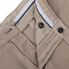 Close-up of Incotex's Dark Beige Cotton Moleskin Model 30 Chinos, showcasing the waistband, zipper, and button details, perfect for achieving a slim fit.