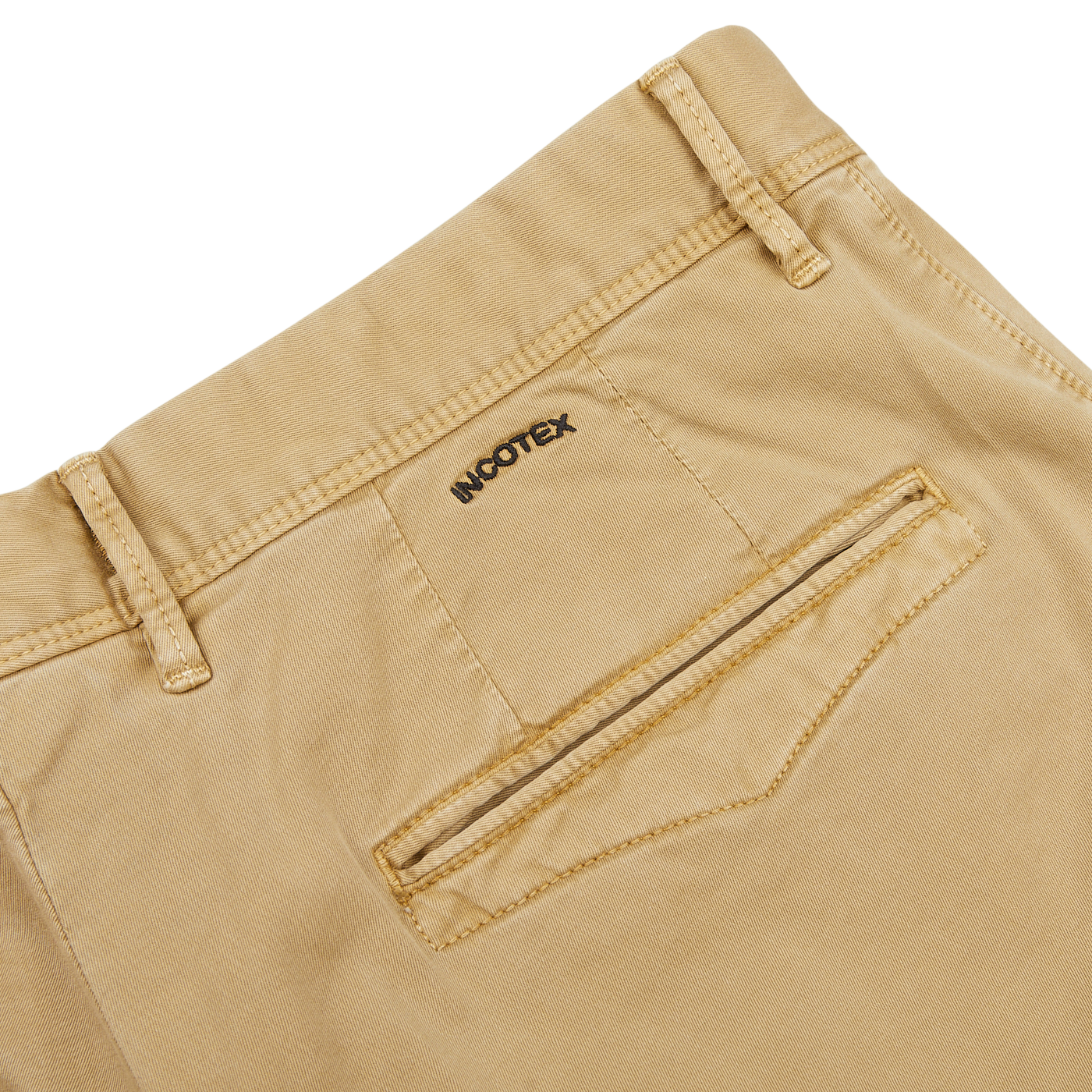 Close-up of Dark Beige Cotton Stretch Slacks Chinos, featuring a back pocket and belt loops. The brand name "Incotex" is embroidered above the pocket. These cotton twill chinos boast a slim fit tapered leg for a modern look.