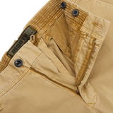 Close-up image of Dark Beige Cotton Stretch Slacks Chinos featuring a partially unbuttoned waist and open fly zipper. The label inside reads "Incotex.