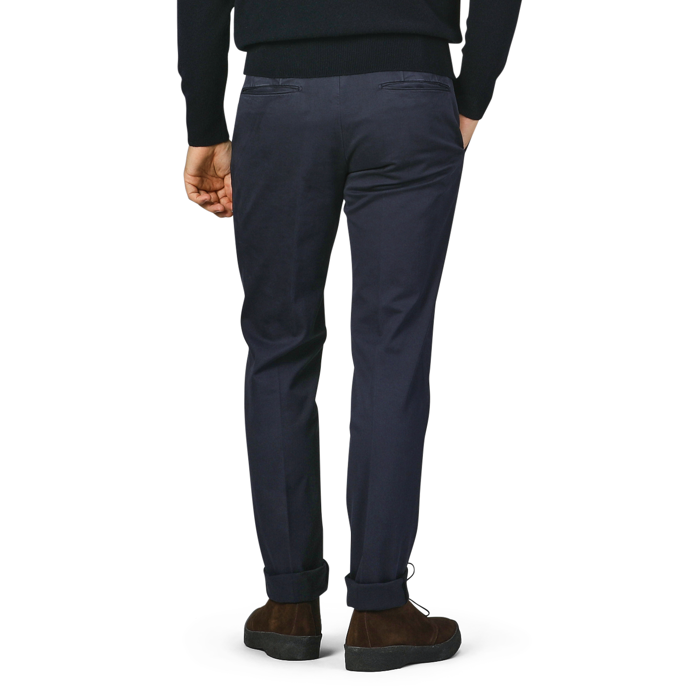 The individual is wearing a pair of Incotex Dark Blue Cotton Stretch Model 30 Chinos along with brown shoes, standing with their back to the camera.