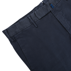 The Incotex Dark Blue Cotton Stretch Model 30 Chinos, featuring belt loops and front pleats, provide a stylish yet comfortable slim fit look against a white background, making them perfect for any occasion.