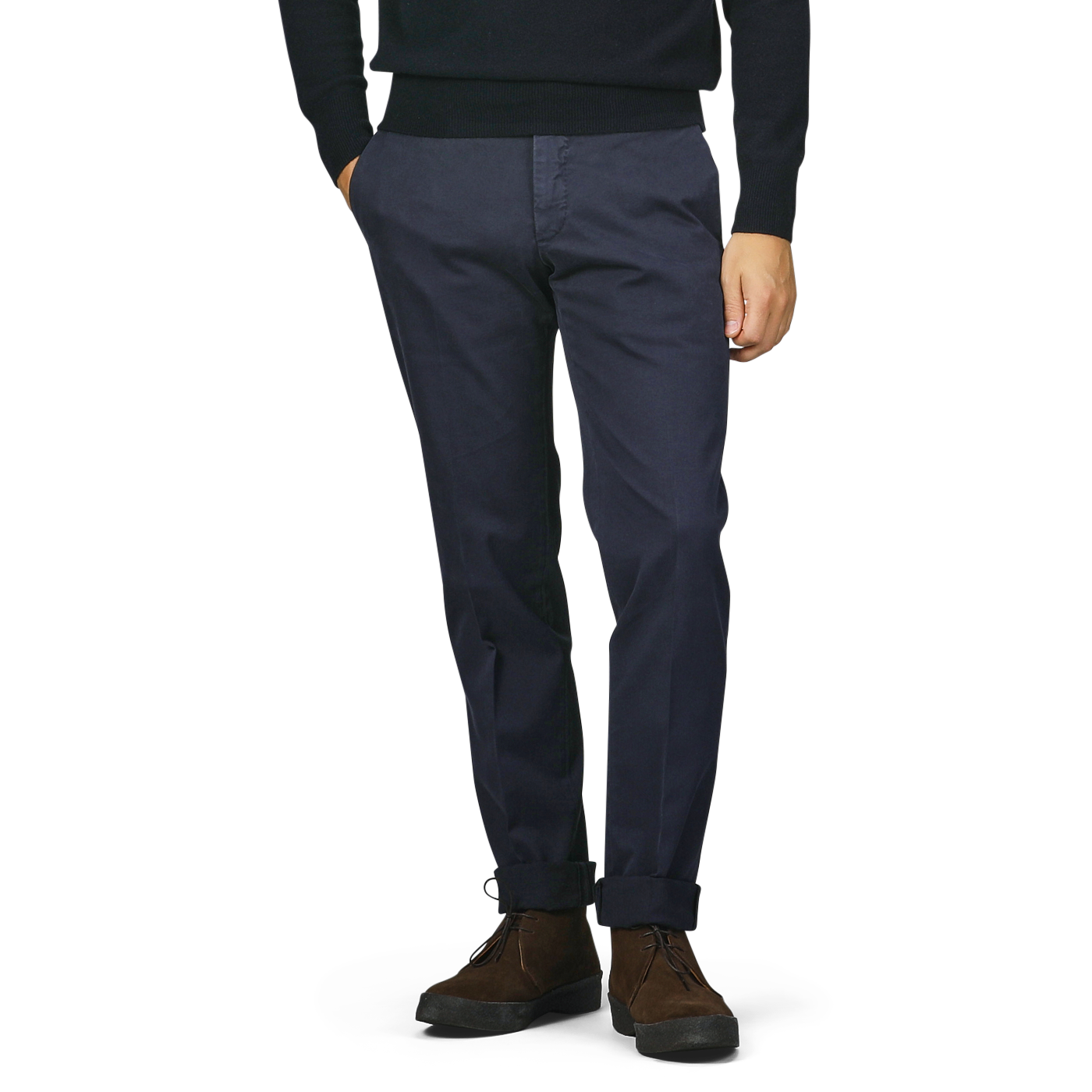 A person is wearing Incotex slim fit dark blue cotton stretch Model 30 chinos and brown shoes, with hands in pockets, against a plain background.