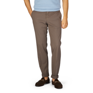 A person wearing royal Incotex cotton stretch regular chinos and brown shoes stands against a white background.