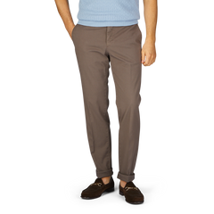 A person wearing royal Incotex cotton stretch regular chinos and brown shoes stands against a white background.