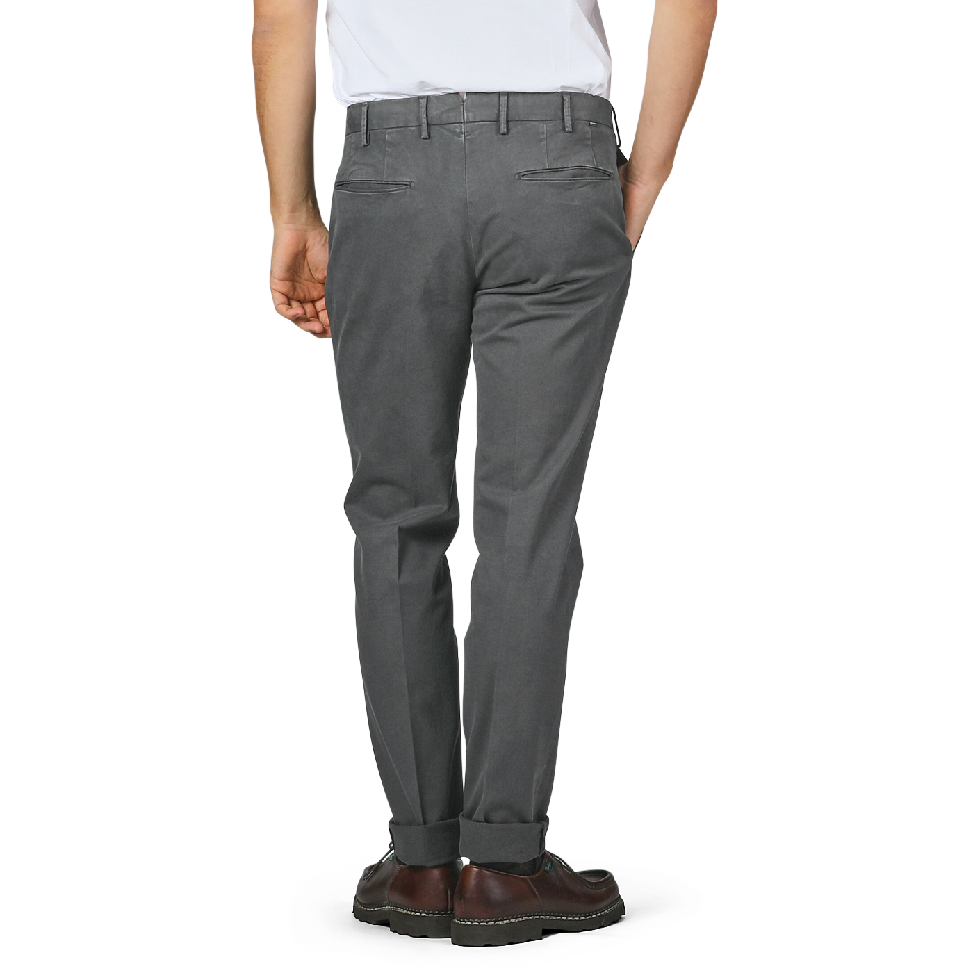 A person wearing Incotex's Dark Grey Cotton Stretch Model 30 Chinos, expertly crafted from cotton twill in a slim fit, paired with brown shoes, viewed from the back.