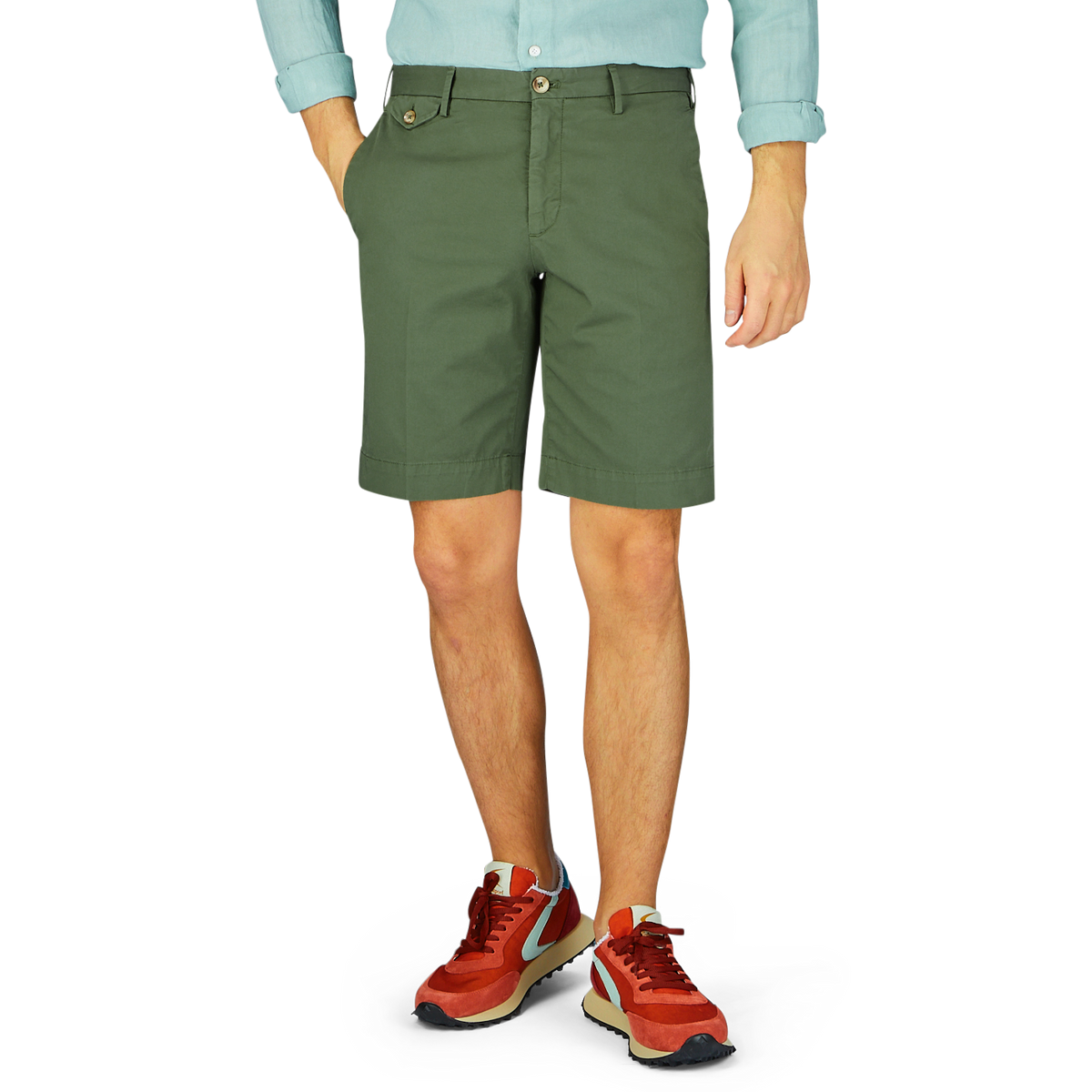 A person standing wearing Grass Green Cotton Royal Batavia Shorts by Incotex and sporty sneakers.