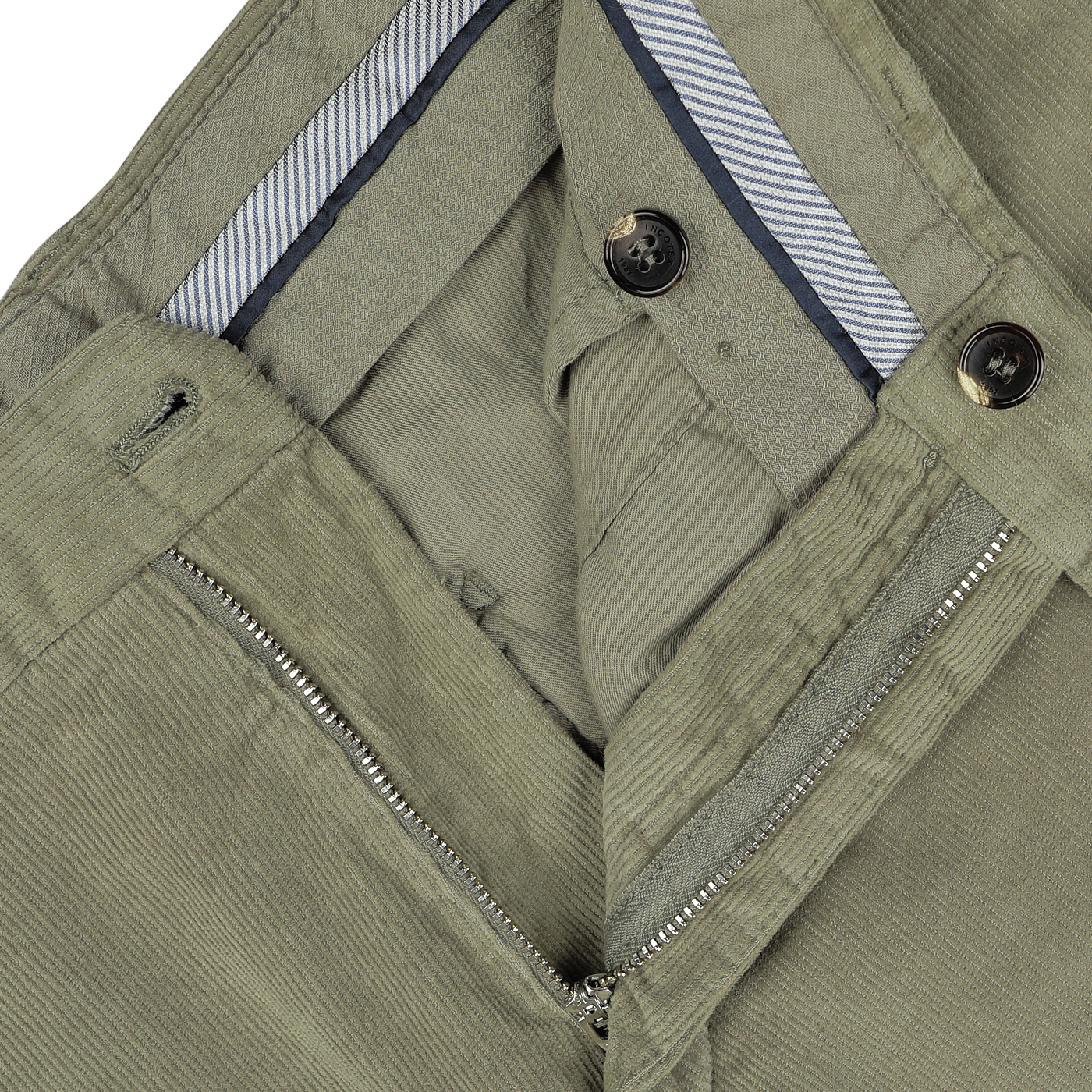 Close-up of the waist and zipper area of a pair of Green Cotton Corduroy High Comfort Chinos from Incotex, showcasing the fabric texture, a striped waistband lining, and buttons.