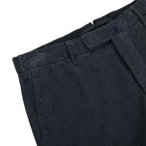 A pair of Grey Micro Cotton Corduroy High Comfort Chinos with blue buttons by Incotex.