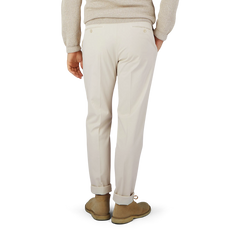 The man is wearing Light Beige Cotton Stretch Regular Chinos by Incotex, creating a stylish look from the back.