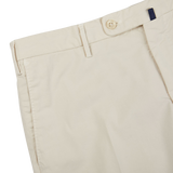 A close up of a pair of Incotex Light Beige Cotton Stretch Regular Chinos, made from cotton with stretch for a comfortable fit.