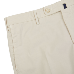 A close up of a pair of Incotex Light Beige Cotton Stretch Regular Chinos, made from cotton with stretch for a comfortable fit.