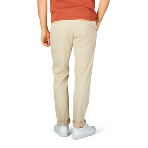 The back view of a man wearing Incotex Light Beige Cotton Stretch Slacks Chinos.