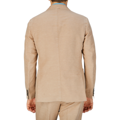 A man viewed from behind wearing a Slowear Light Beige Washed Chinolino Suit jacket.