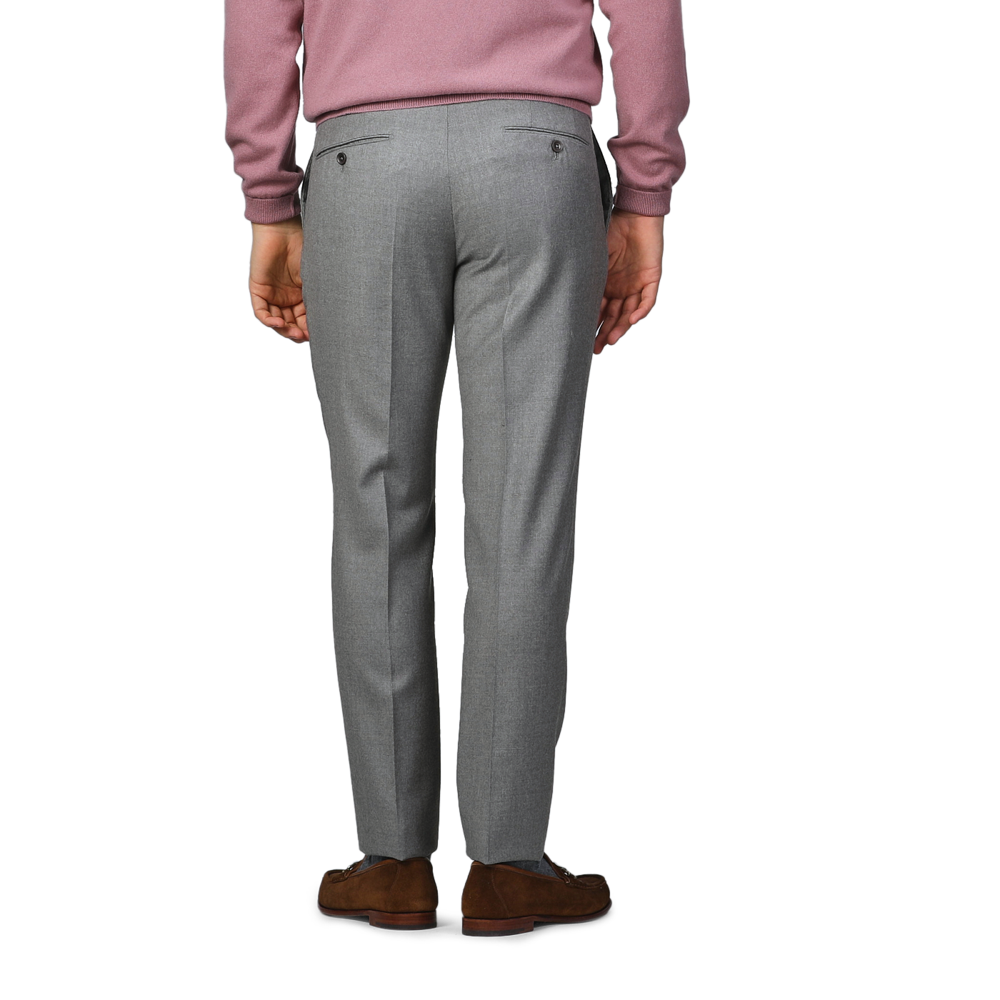 A person wearing Incotex Light Grey Wool Flannel Slim Trousers, a pink sweater, and brown shoes stands facing away.