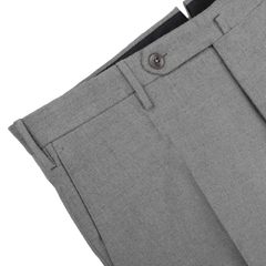 The Light Grey Wool Flannel Slim Trousers by Incotex are displayed on a white surface, highlighting their slim fit design with a single button and belt loops.