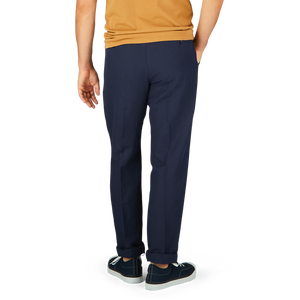A person standing in navy Blue Chinolino Straight Fit Trousers from Incotex and casual sneakers.