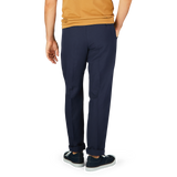 A person standing in navy Blue Chinolino Straight Fit Trousers from Incotex and casual sneakers.