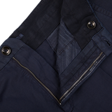 Close-up of a navy blue Incotex Chinolino Straight Fit Trousers with a zipper and button details.