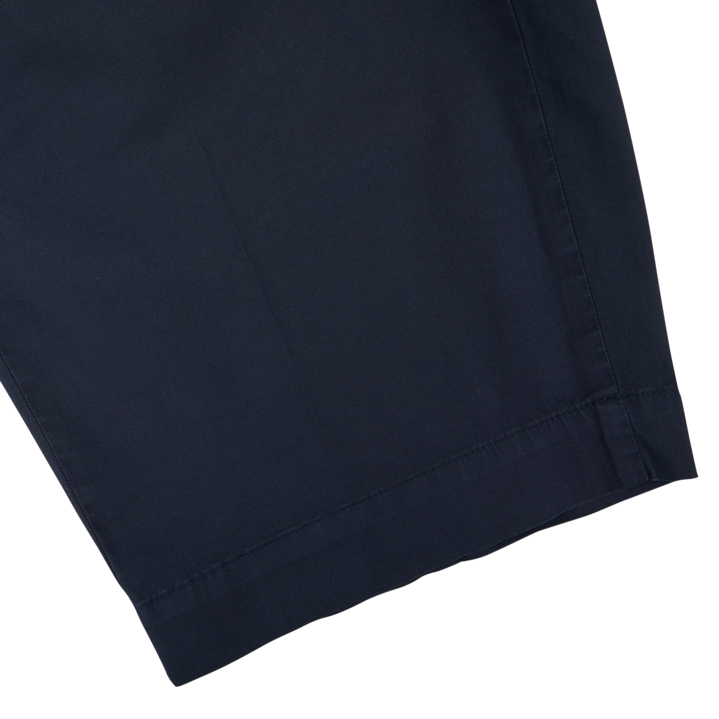 Close-up of a Incotex navy blue cotton high comfort shorts hem on a white background.